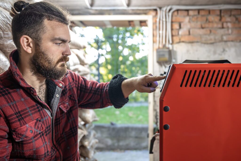 Technician inspecting a generator to prevent generator problems during outages and ensure reliable performance.