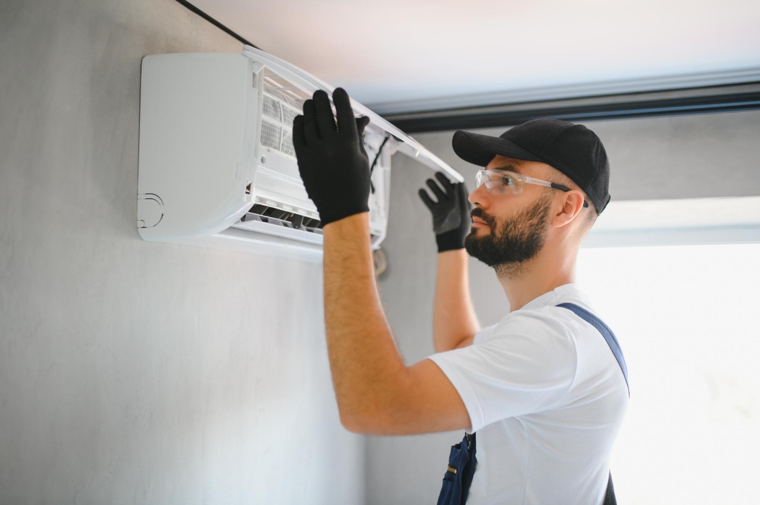 frozen evaporator coils on an indoor AC unit